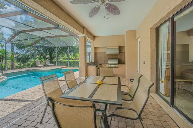 a view of an outdoor dining space with a table and chairs