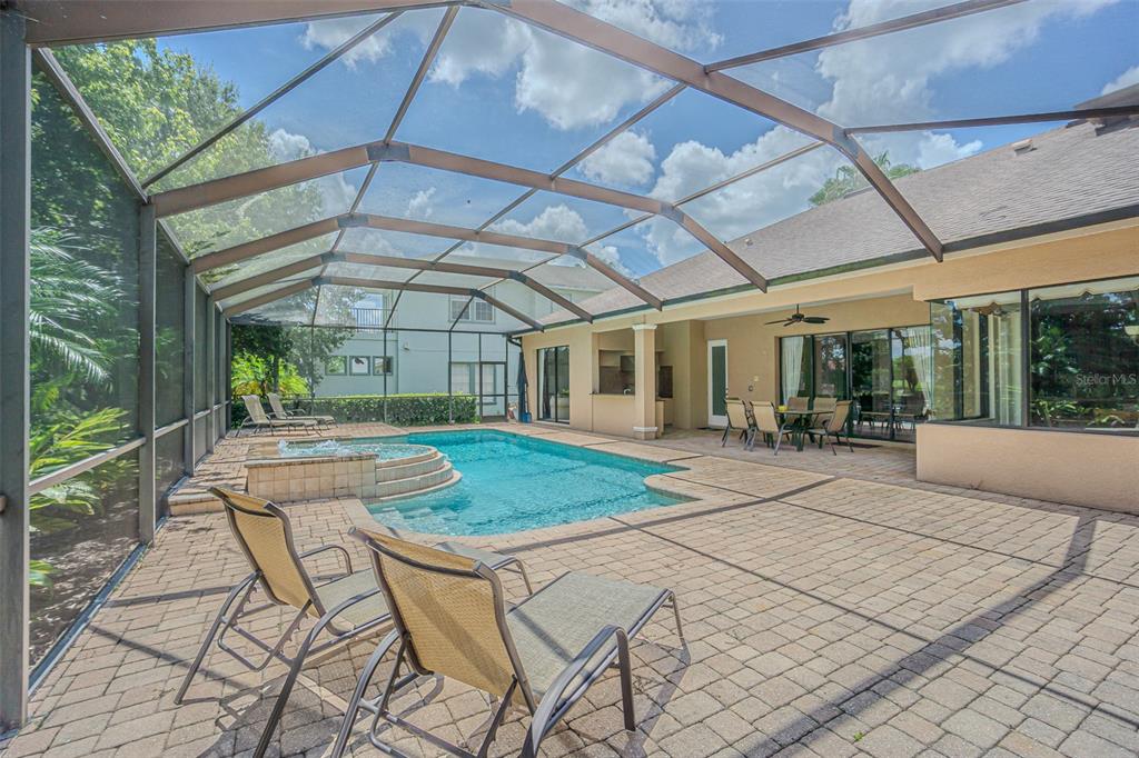 20411 Lace Cascade Road Land O Lakes, FL 34637 - Photo 4 of 44 a house view with swimming pool and outdoor seating