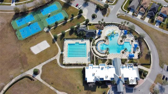 an aerial view of a house with a swimming pool