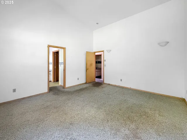 a spacious bathroom with a granite countertop sink mirror and a window