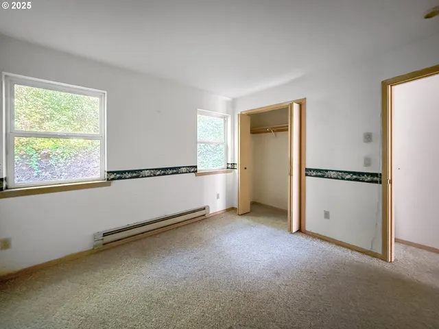 a bathroom with a tub a sink and a shower