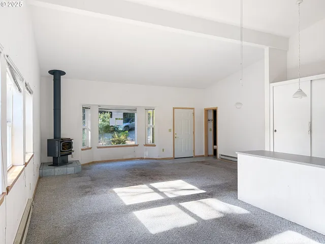 a view of livingroom with furniture and window