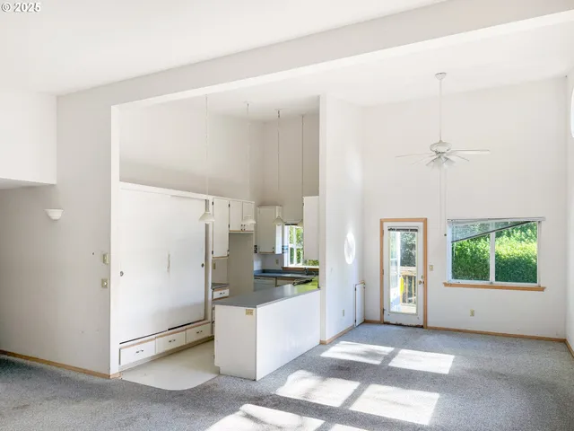 a view of a open shower and a window