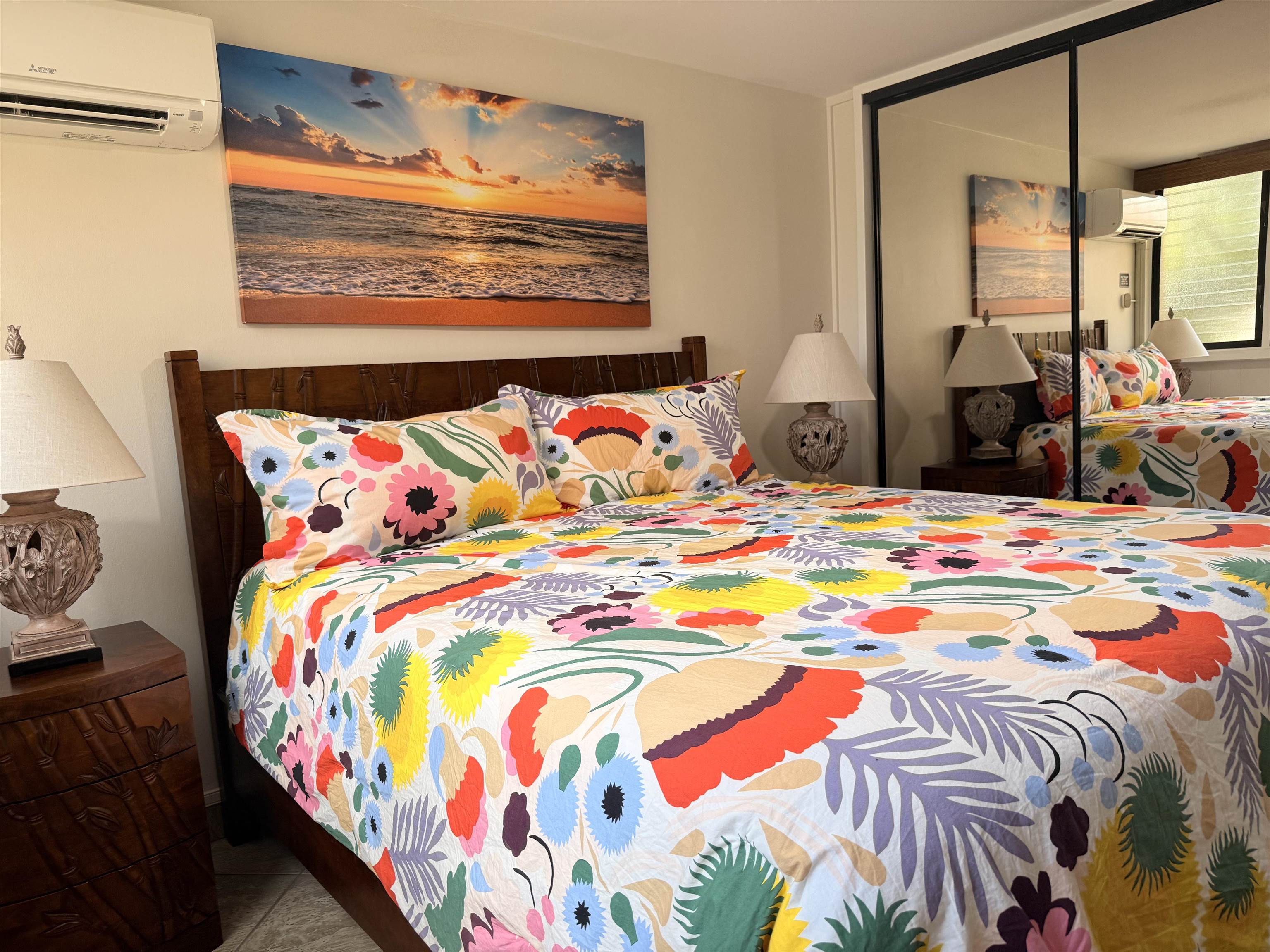3701 Lower Honoapiilani Road, Unit 105 Lahaina, HI 96761 - Photo 11 of 36 a bedroom with a bed and painting on the wall