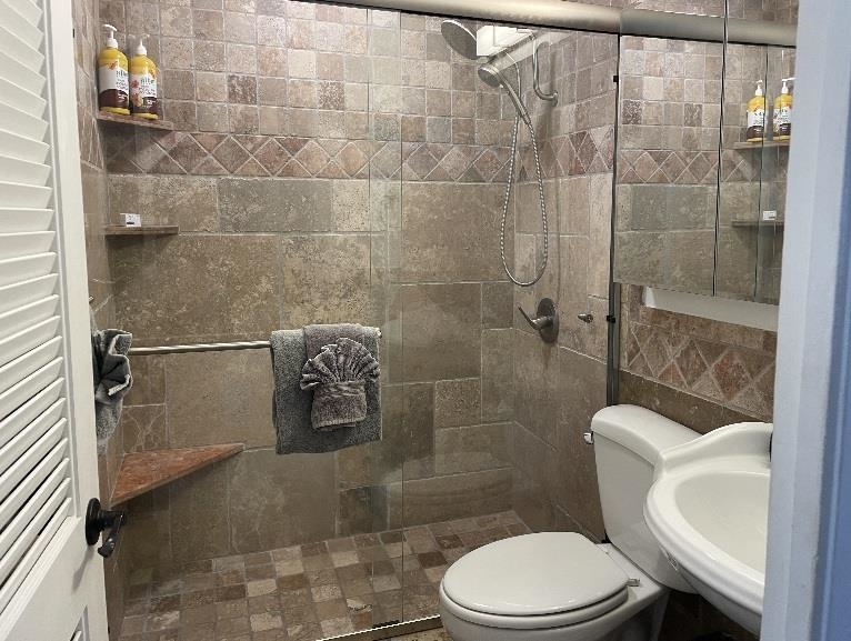 3701 Lower Honoapiilani Road, Unit 105 Lahaina, HI 96761 - Photo 14 of 36 a bathroom with a toilet and shower