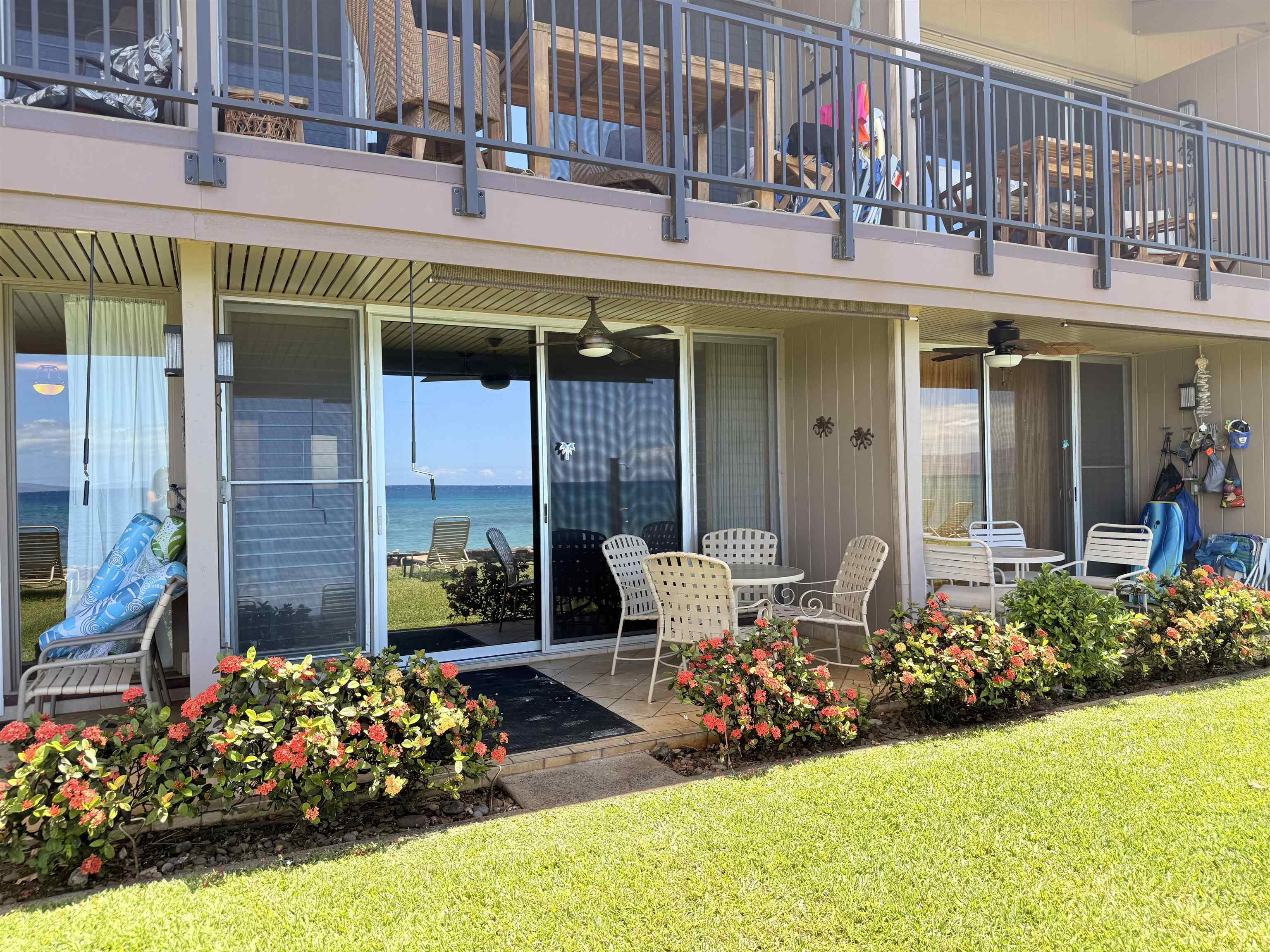 3701 Lower Honoapiilani Road, Unit 105 Lahaina, HI 96761 - Photo 33 of 36 a view of a living room with a large window and chairs