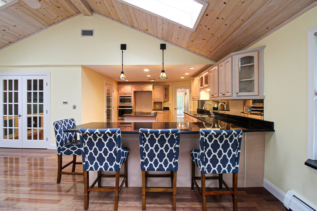 1116 George Hill Road Lancaster, MA 01523 - Photo 13 of 37 a dining room with furniture and wooden floor
