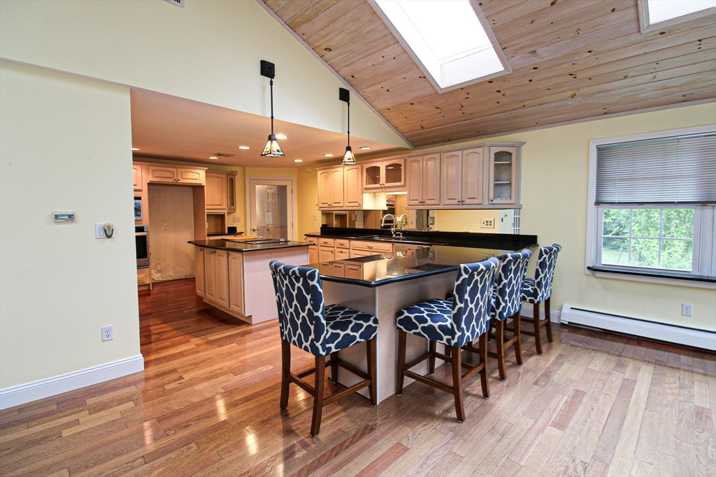 1116 George Hill Road Lancaster, MA 01523 - Photo 14 of 37 a large kitchen with a table and chairs