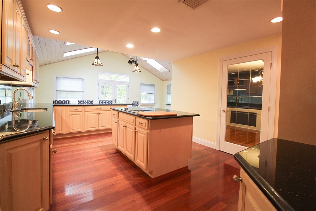 1116 George Hill Road Lancaster, MA 01523 - Photo 15 of 37 a large kitchen with stainless steel appliances granite countertop a stove and a sink
