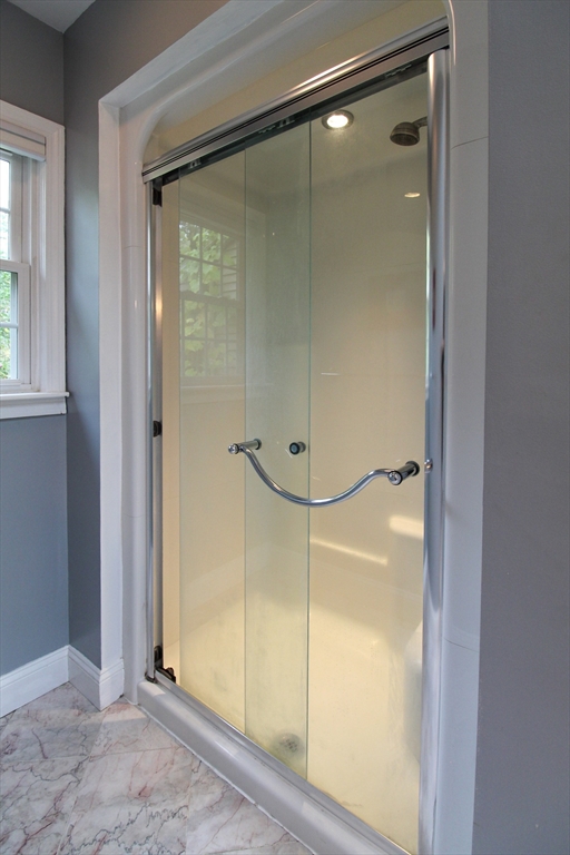 1116 George Hill Road Lancaster, MA 01523 - Photo 20 of 37 a bathroom with a glass shower door