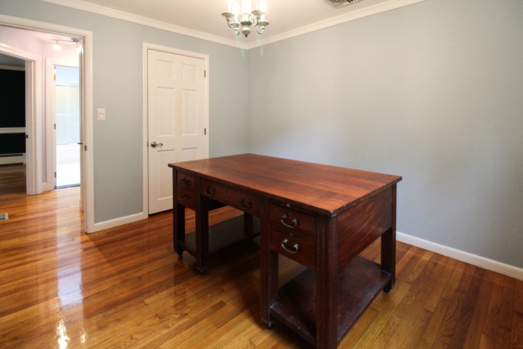1116 George Hill Road Lancaster, MA 01523 - Photo 21 of 37 a room with wooden floor and furniture