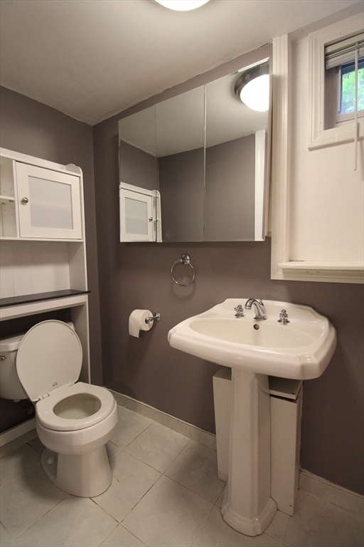 1116 George Hill Road Lancaster, MA 01523 - Photo 28 of 37 a bathroom with a toilet a sink and mirror