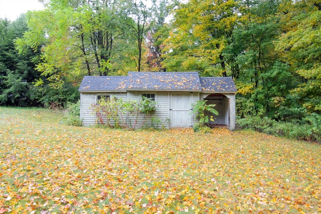 1116 George Hill Road Lancaster, MA 01523 - Photo 37 of 37 a house with trees in front of it