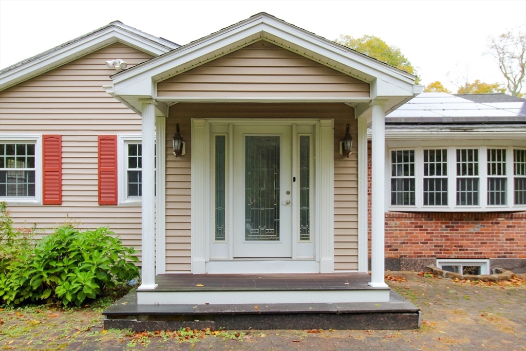 1116 George Hill Road Lancaster, MA 01523 - Photo 5 of 37 front view of a house with a small porch