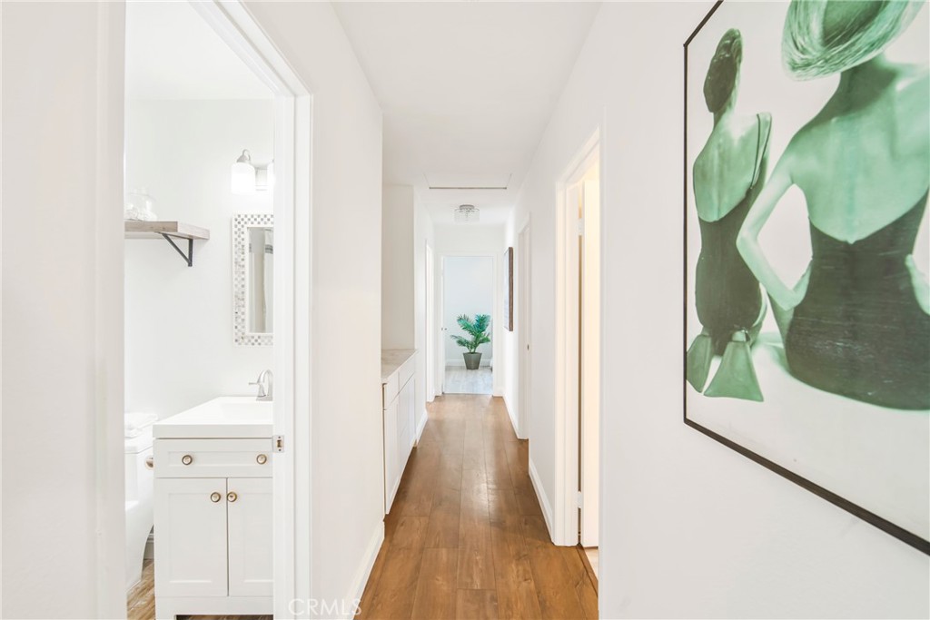 2810 Bello Panorama San Clemente, CA 92673 - Photo 20 of 67 a view of a hallway with wooden floor and door