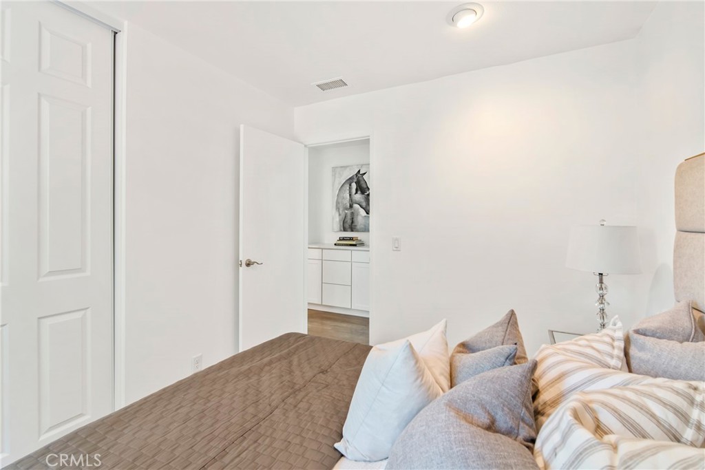 2810 Bello Panorama San Clemente, CA 92673 - Photo 28 of 67 a bedroom with a bed and a couch