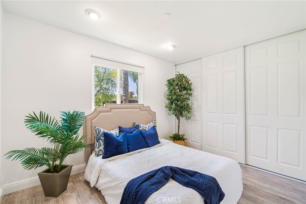 2810 Bello Panorama San Clemente, CA 92673 - Photo 29 of 67 a bedroom with a large bed and a potted plant