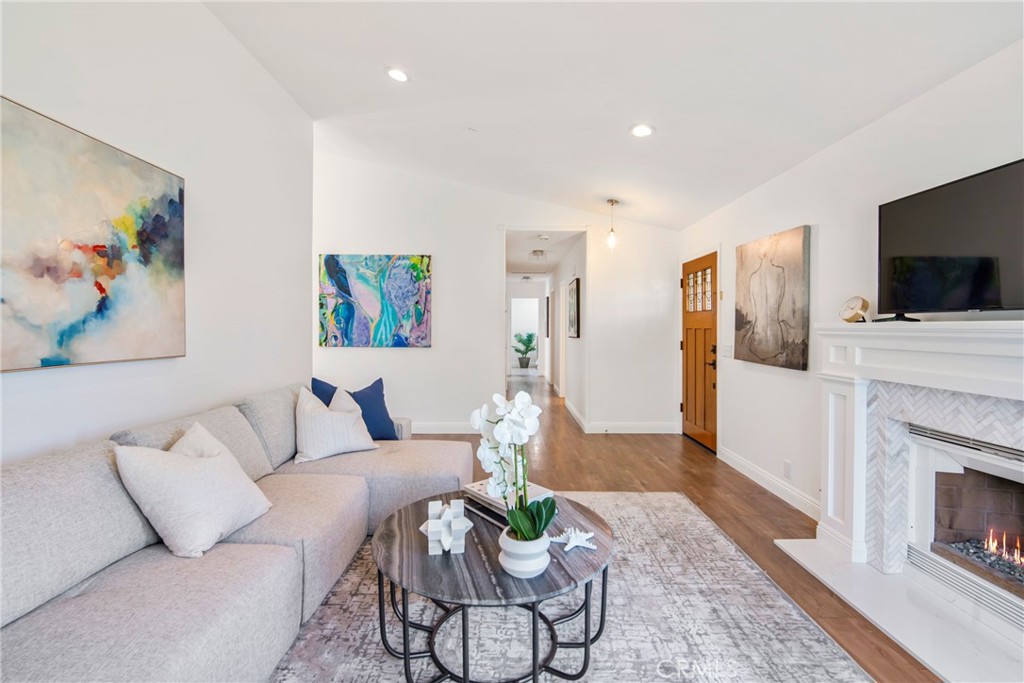 2810 Bello Panorama San Clemente, CA 92673 - Photo 8 of 67 a living room with furniture a flat screen tv and a fireplace