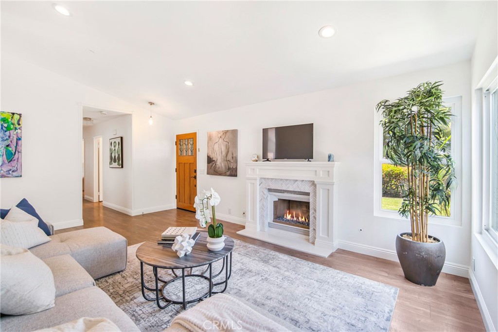 2810 Bello Panorama San Clemente, CA 92673 - Photo 10 of 67 a living room with furniture a flat screen tv and a fireplace