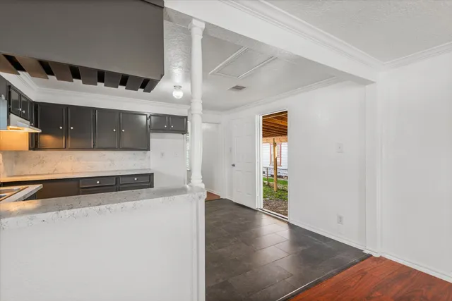 an entryway with wooden floor