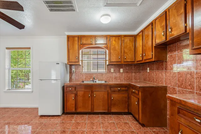 a kitchen with a sink and cabinets