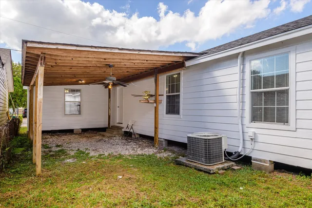 a view of a backyard with a large tree