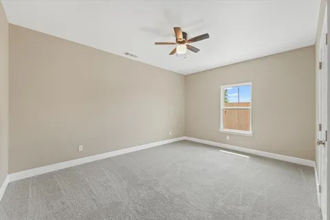 a view of a big room with carpet