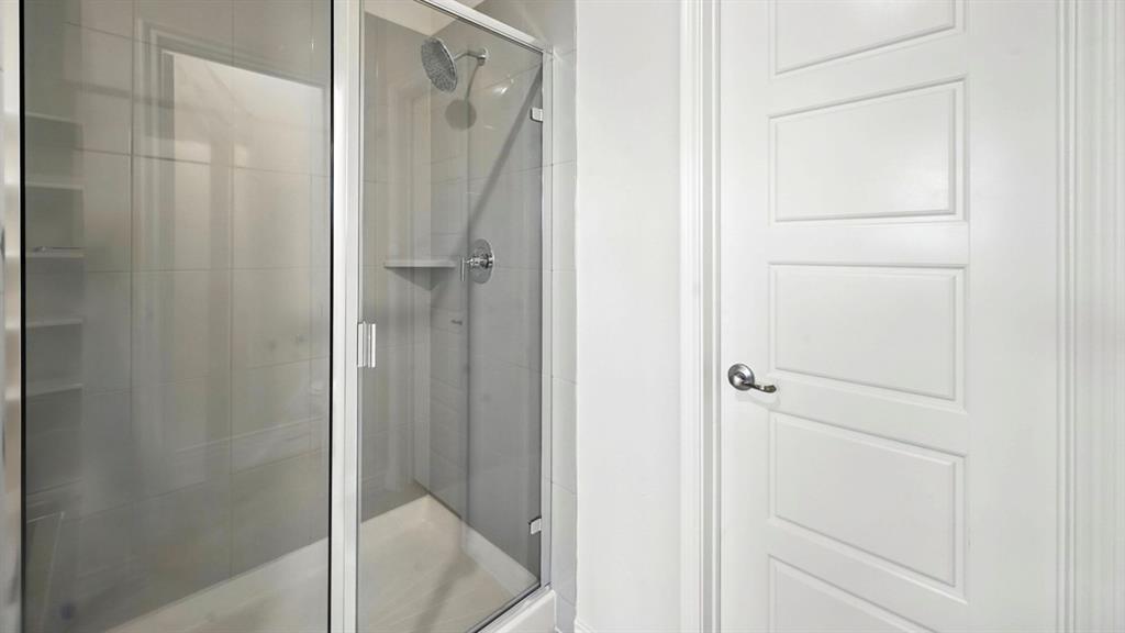 3516 Ample Vista Road Aubrey, TX 76227 - Photo 2 of 36 a bathroom with a glass shower door