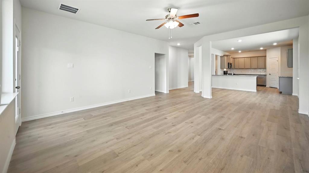 3516 Ample Vista Road Aubrey, TX 76227 - Photo 31 of 36 wooden floor in an empty room with a window