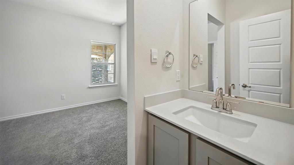 3516 Ample Vista Road Aubrey, TX 76227 - Photo 6 of 36 a bathroom with a sink and a mirror