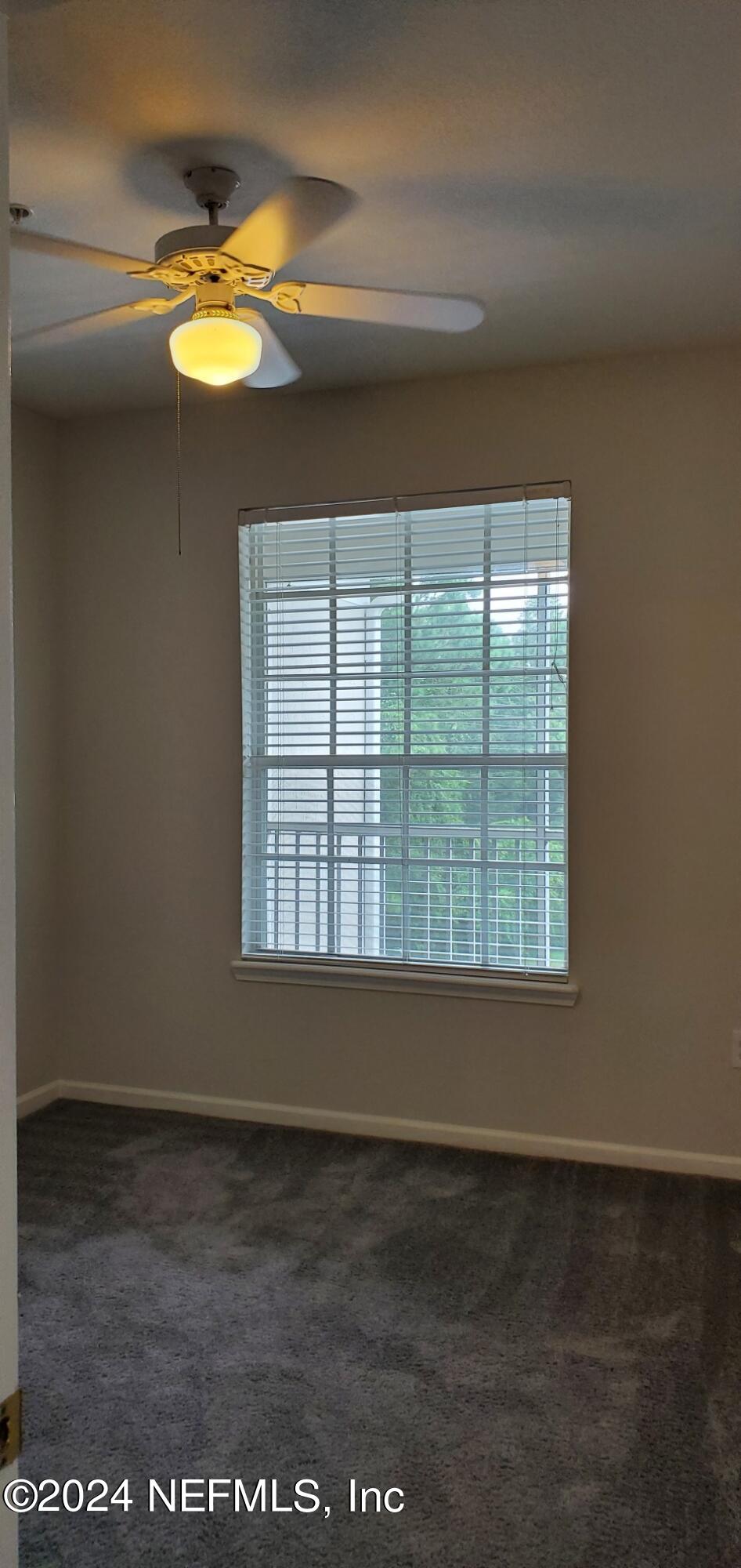 10550 Baymeadows Road, Unit 1012 Jacksonville, FL 32256 - Photo 11 of 18 a view of an empty room with a window