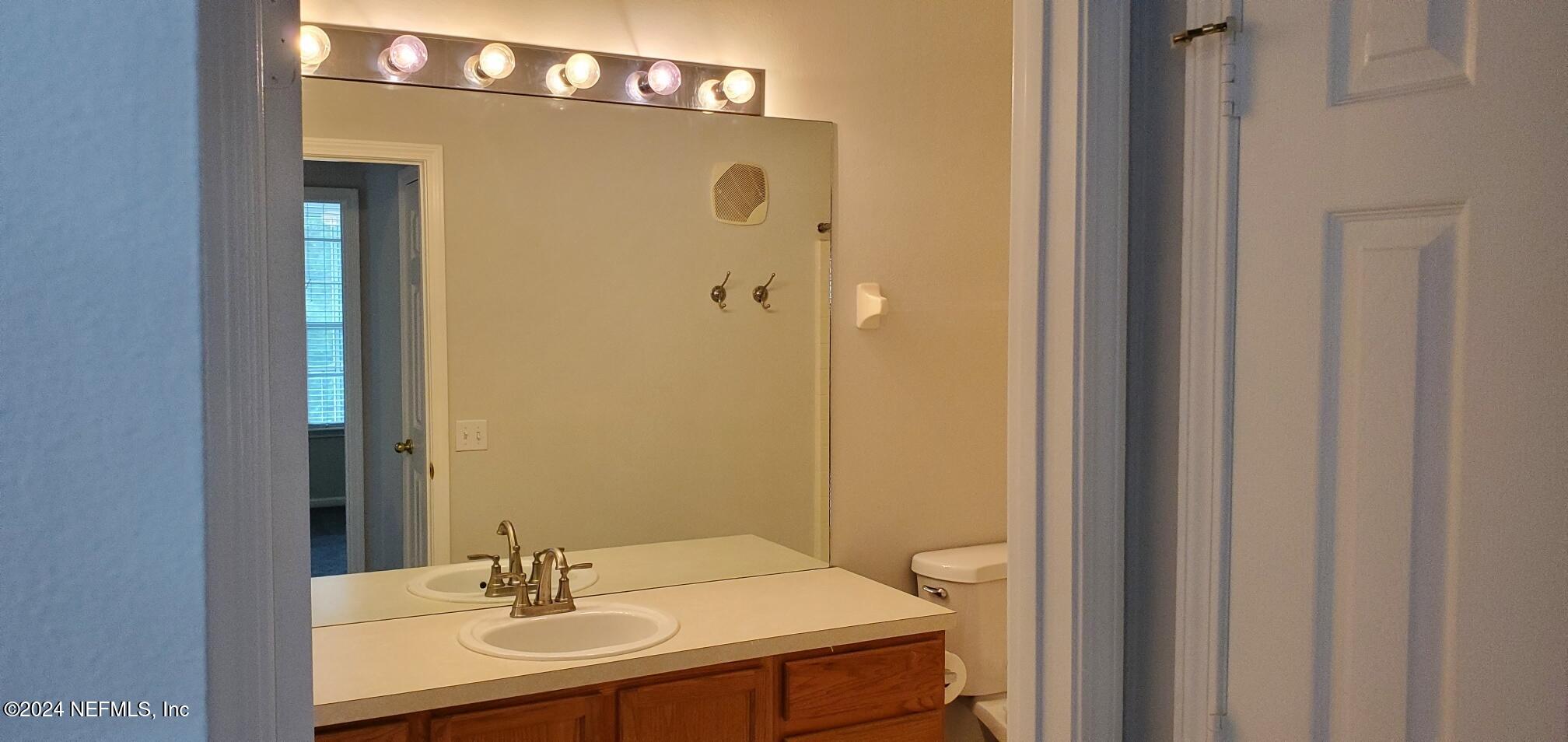 10550 Baymeadows Road, Unit 1012 Jacksonville, FL 32256 - Photo 15 of 18 a bathroom with a sink a toilet and shower