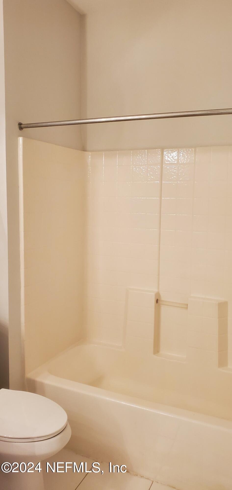 10550 Baymeadows Road, Unit 1012 Jacksonville, FL 32256 - Photo 16 of 18 a bathroom with a shower and a toilet