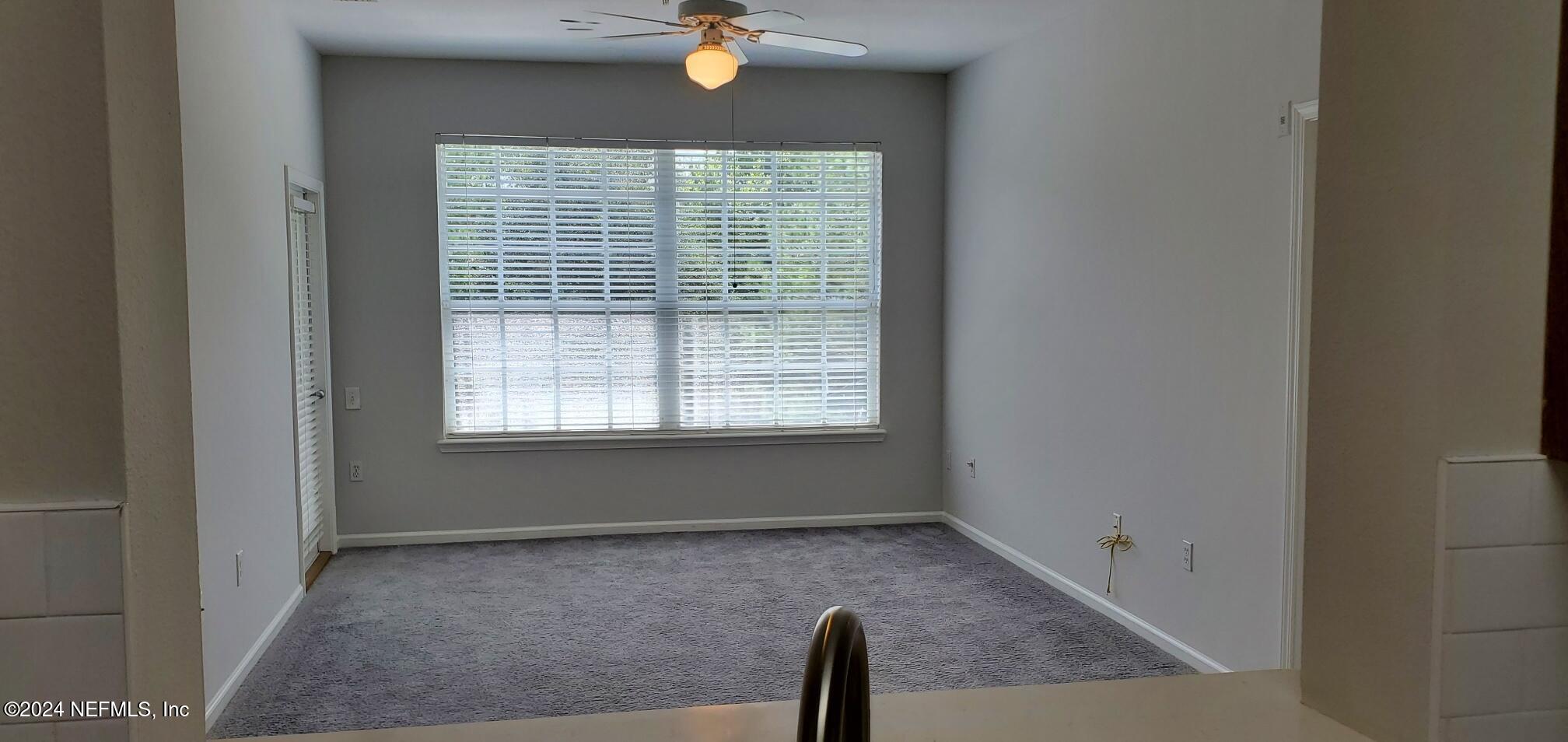 10550 Baymeadows Road, Unit 1012 Jacksonville, FL 32256 - Photo 5 of 18 a view of an empty room with a window