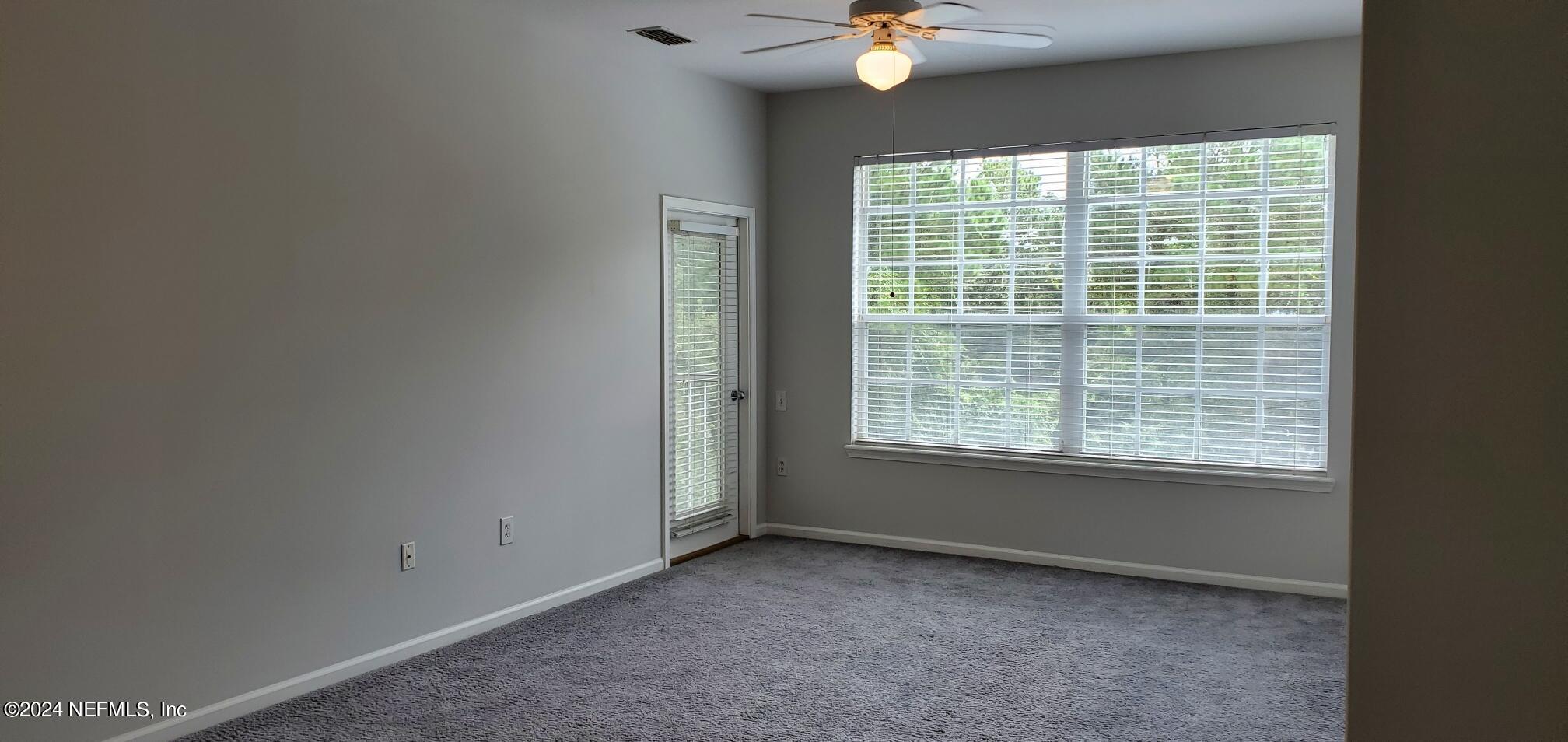 10550 Baymeadows Road, Unit 1012 Jacksonville, FL 32256 - Photo 6 of 18 a view of an empty room with a window