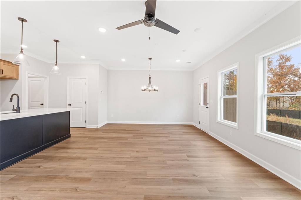 328 Colsen Drive Acworth, GA 30102 - Photo 13 of 23 a view of an empty room with window and wooden floor