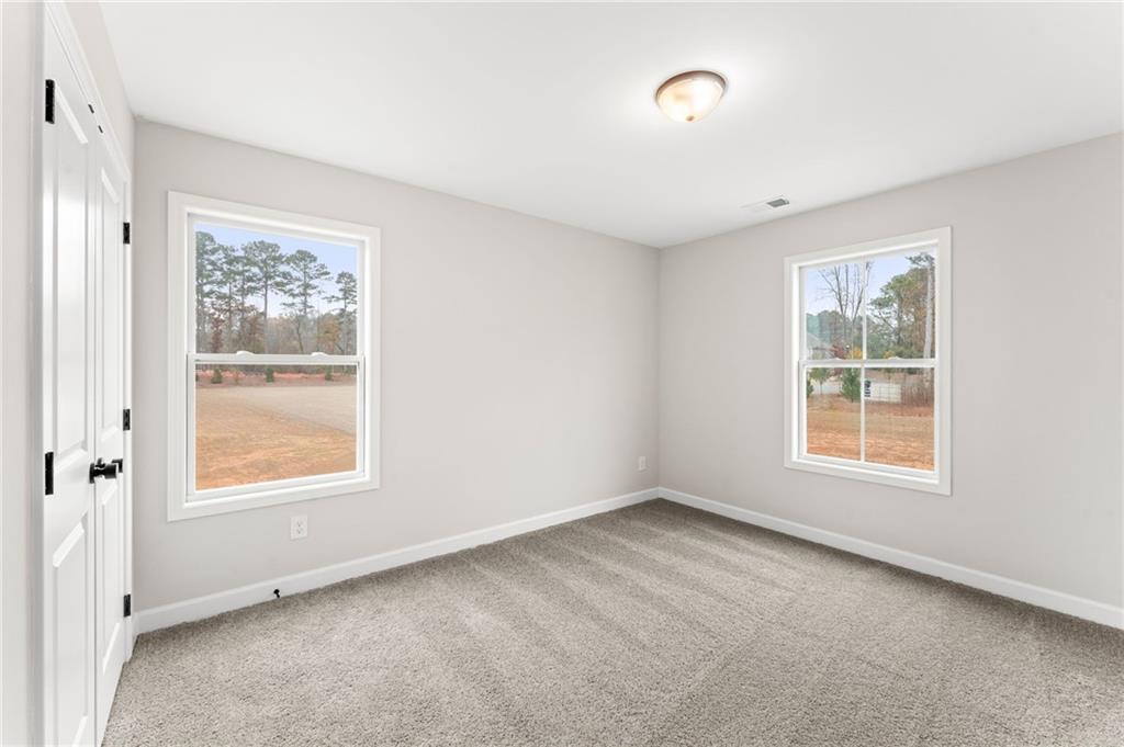 328 Colsen Drive Acworth, GA 30102 - Photo 21 of 23 a view of an empty room with a window