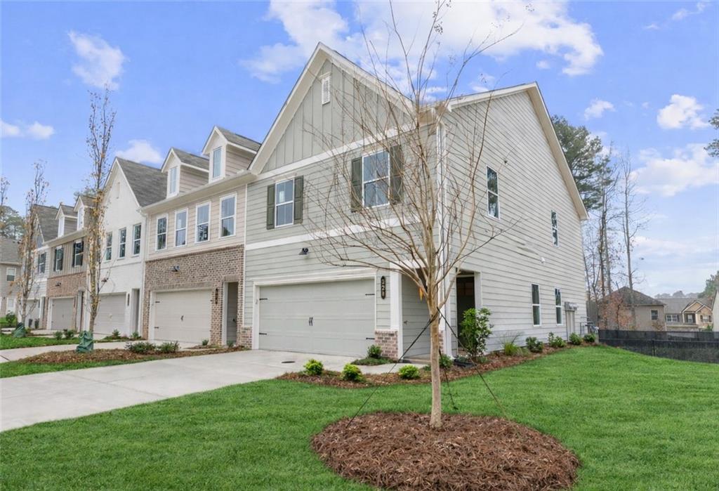 328 Colsen Drive Acworth, GA 30102 - Photo 6 of 23 a view of a white house next to a yard
