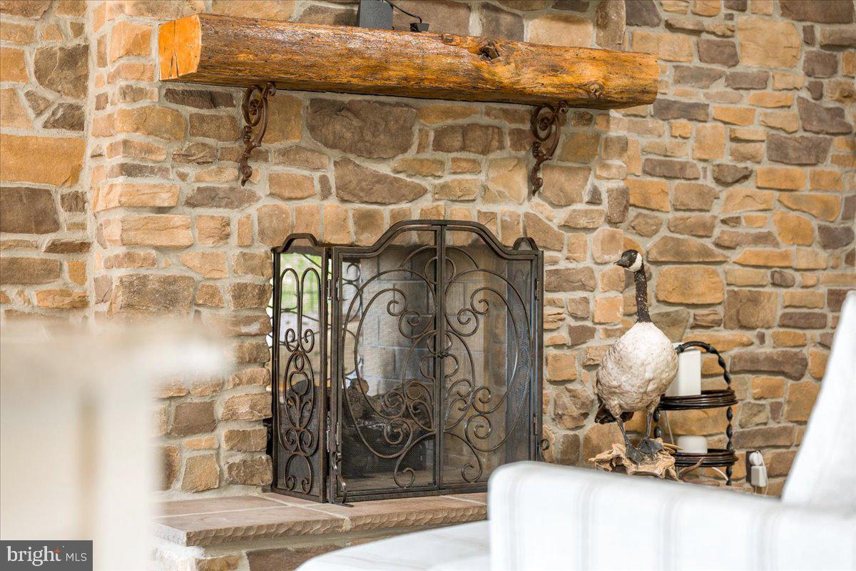 12565 Stone Crest Circle Waynesboro, PA 17268 - Photo 34 of 146 Seating area by kitchen w/ double-sided fireplace