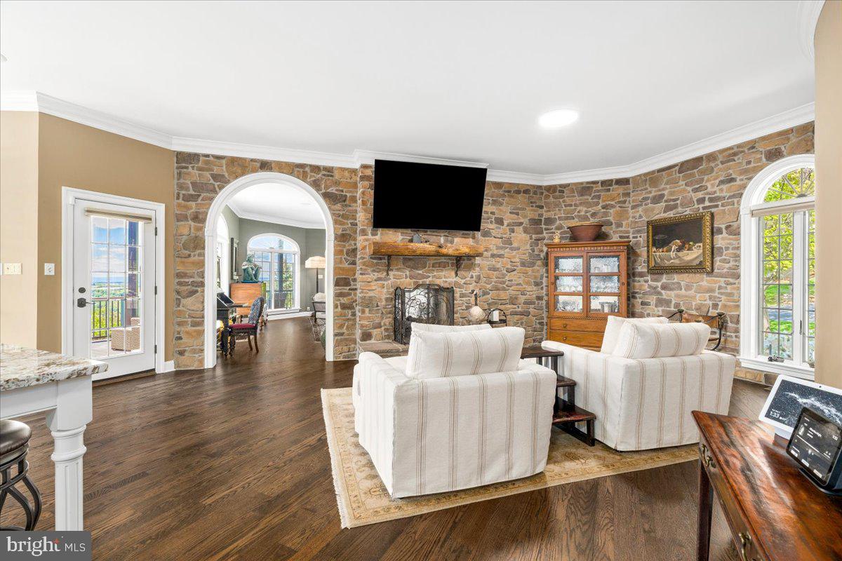 12565 Stone Crest Circle Waynesboro, PA 17268 - Photo 35 of 146 Seating area by kitchen w/ double-sided fireplace