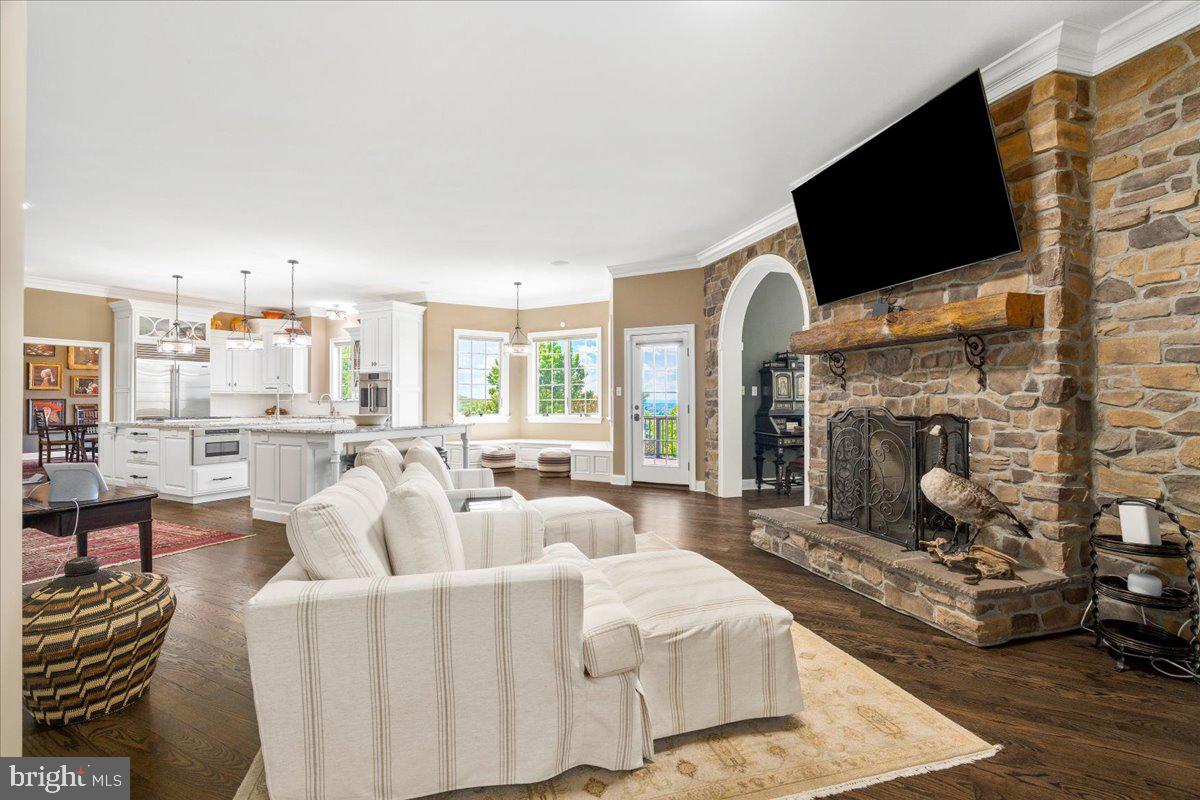 12565 Stone Crest Circle Waynesboro, PA 17268 - Photo 5 of 146 Open concept w/ double-sided stone fireplace