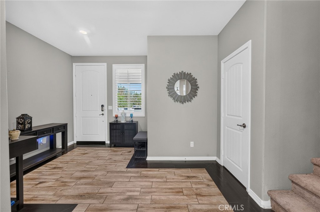 23347 Crystal Way Wildomar, CA 92595 - Photo 9 of 109 a view of a livingroom with wooden floor and a window