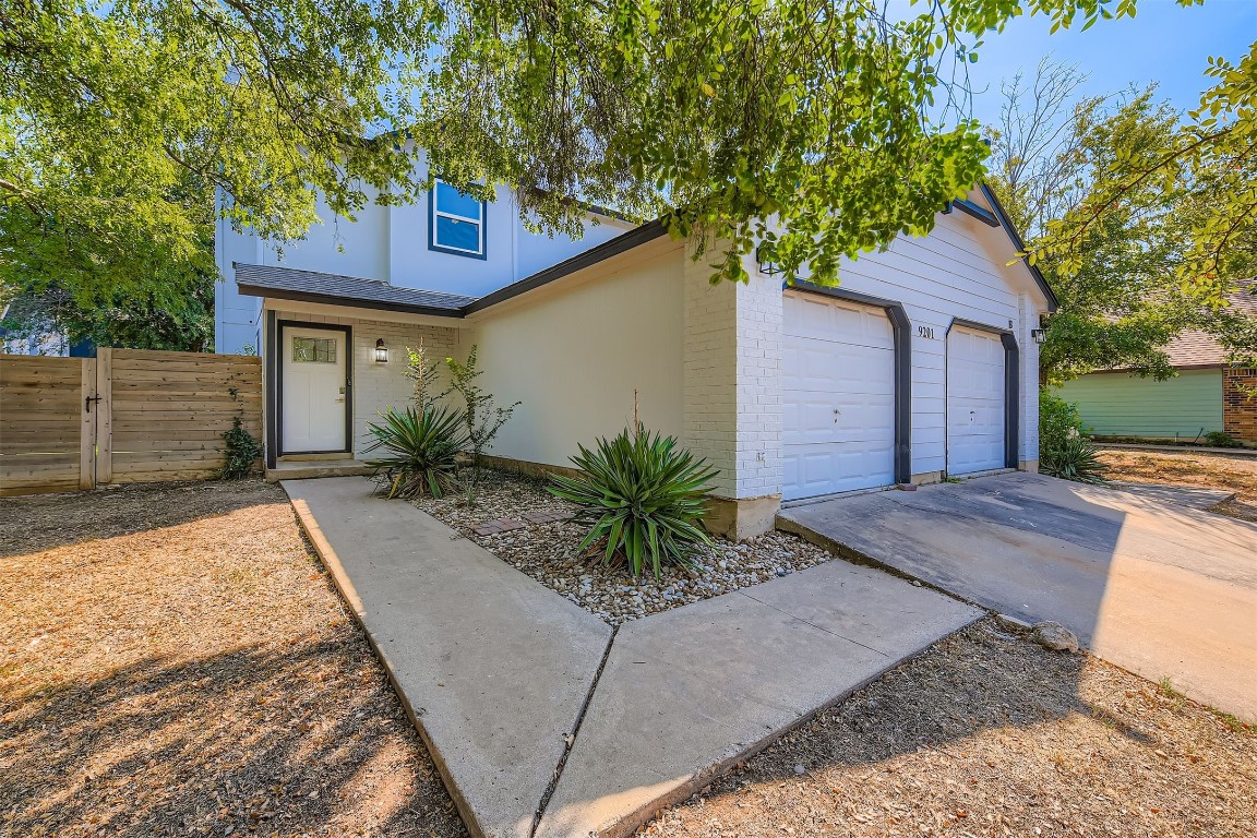 9201 Sedgemoor Trail, Unit A Austin, TX 78748 - Photo 2 of 11 a house view with a garden space