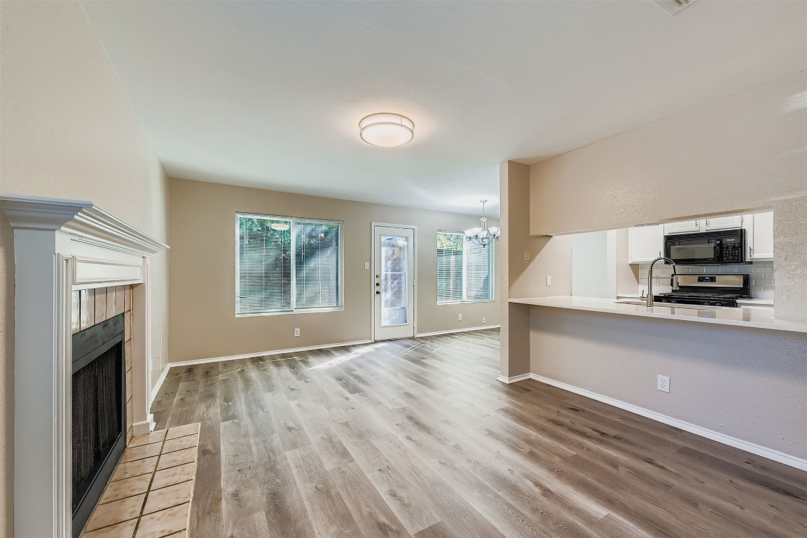 9201 Sedgemoor Trail, Unit A Austin, TX 78748 - Photo 4 of 11 an empty room with wooden floor and a window