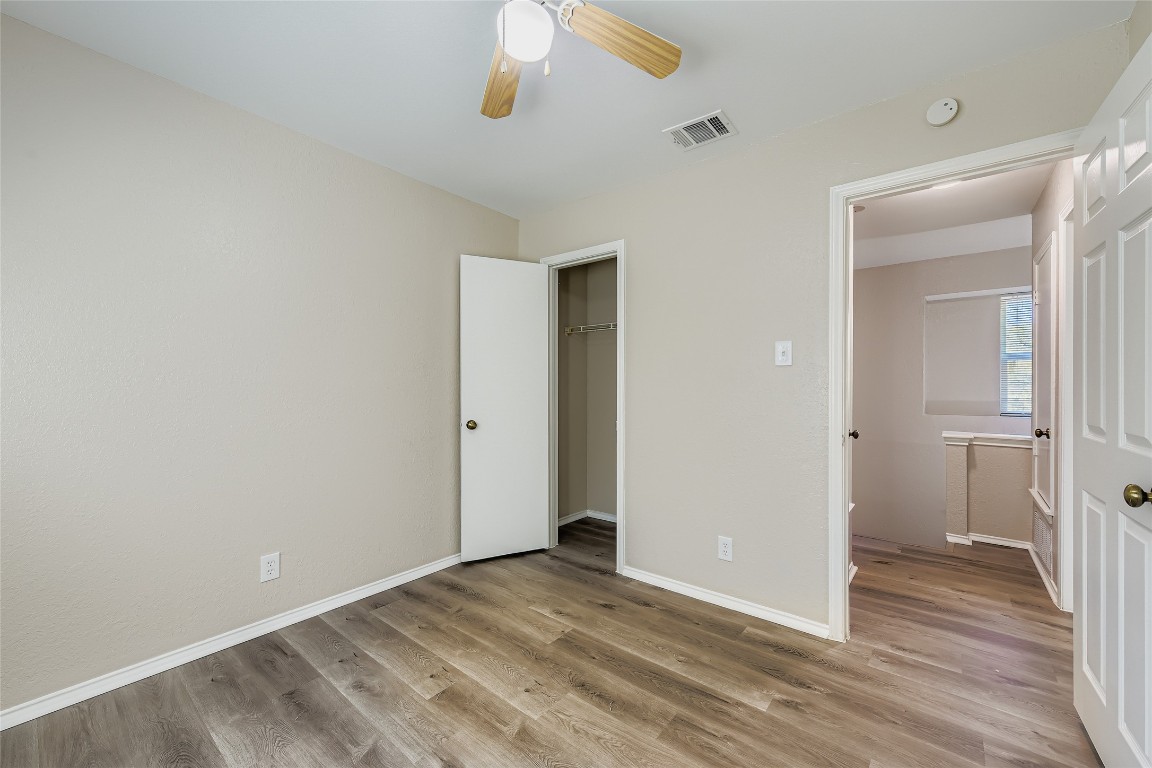 9201 Sedgemoor Trail, Unit A Austin, TX 78748 - Photo 10 of 11 a view of an empty room with wooden floor
