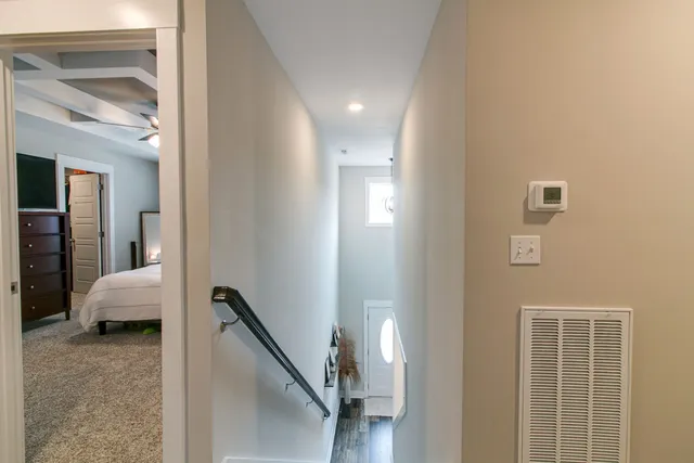 a view of a hallway with couch and entryway