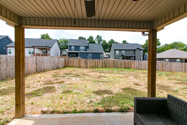 a view of a swimming pool with a patio