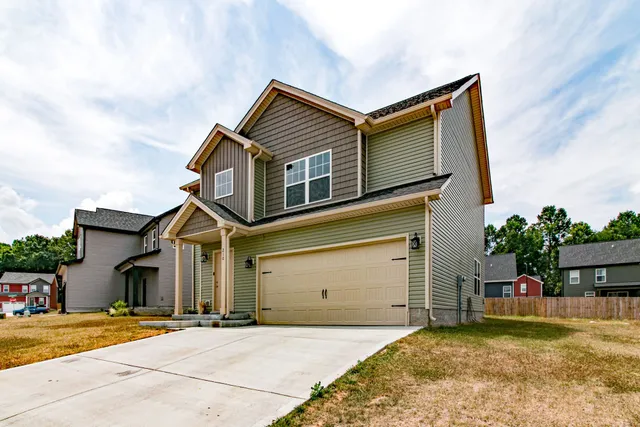 front view of a house with a yard