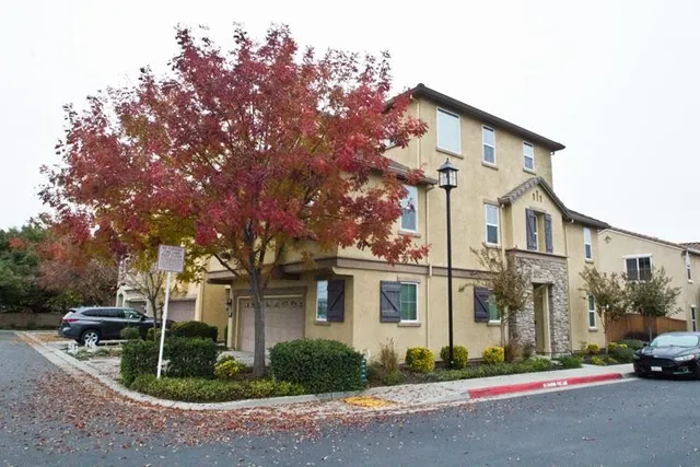 a view of street along with residential houses