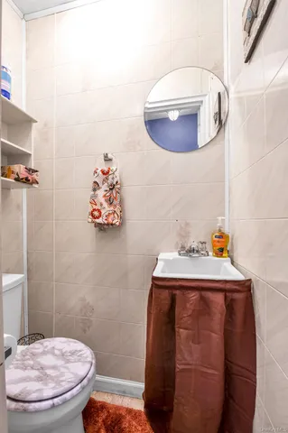 a bathroom with a toilet and a sink